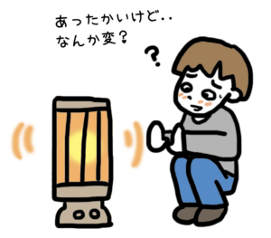 ストーブにあたって体調が変化している男子
