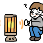 ストーブにあたって体調が変化している男子